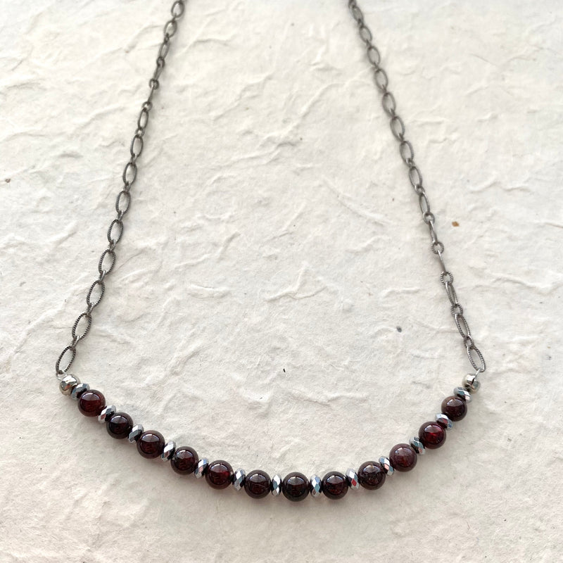 Deep Red Garnet and Hematite Beads on a Gray Chain