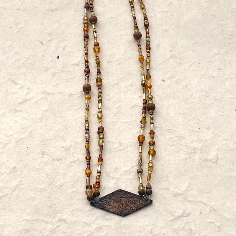 Gold Multicolored Glass Beaded Necklace with Copper Focal Charm